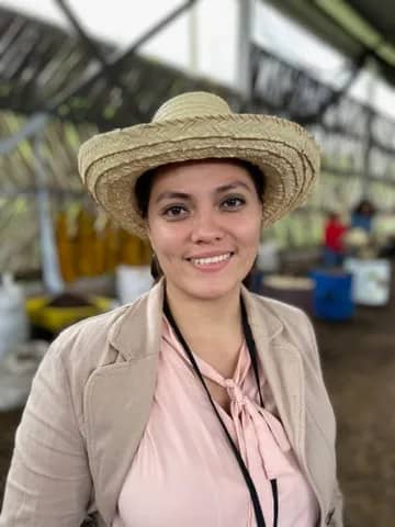 young business-woman wearing straw hat